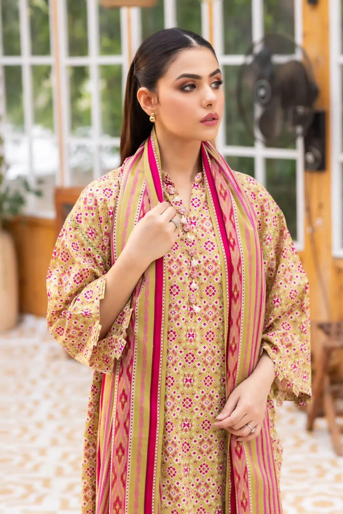 Printed lawn suit with a bold striped dupatta